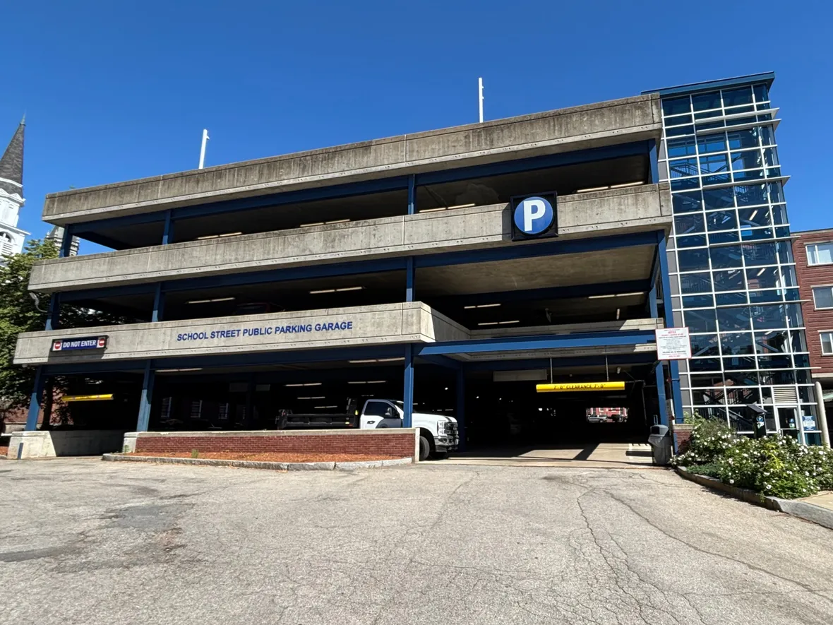 Signage for Joe King's customer parking on the Warren St. side