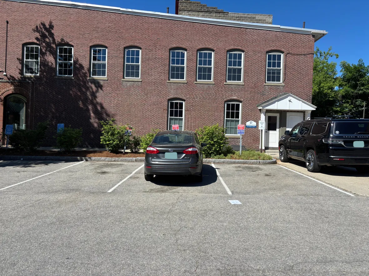 Joe King's free customer parking spots near the School St. Garage entrance